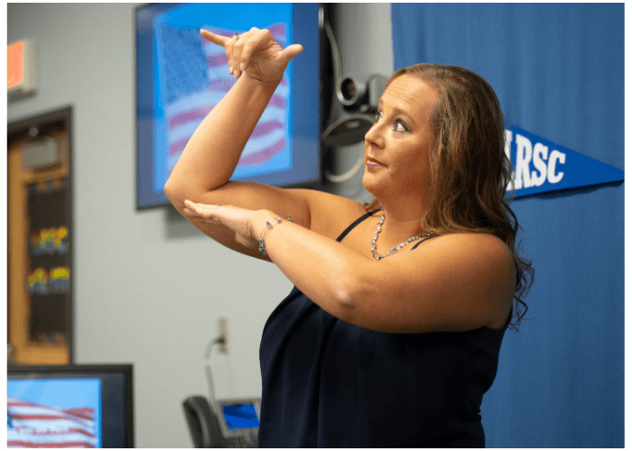 Lake Region State College instructor signing to students during an American Sign Language class.