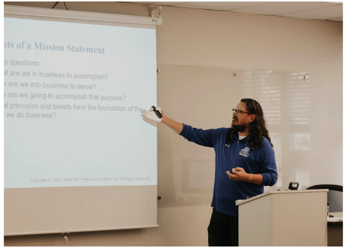 Instructor teaching a class in the Business Administration program.