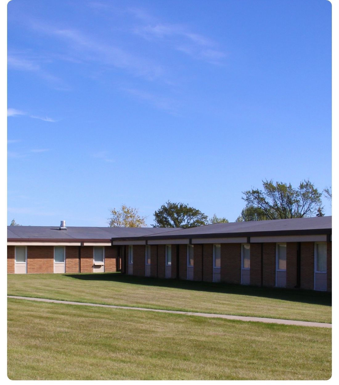 Exterior view of North Hall, a Lake Region State College residence hall, showing the brick building.