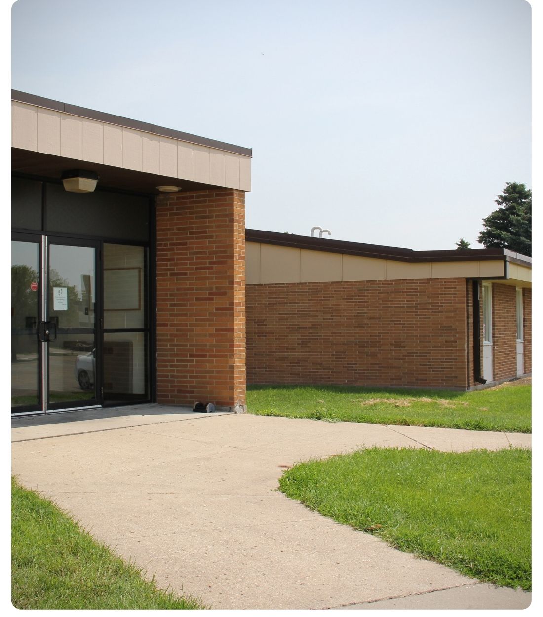Exterior view of South Hall, a Lake Region State College residence hall, showing the brick building and main entrance.