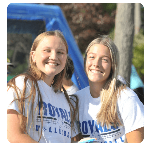 LRSC Royals volleyball students wearing team shirts outdoors.