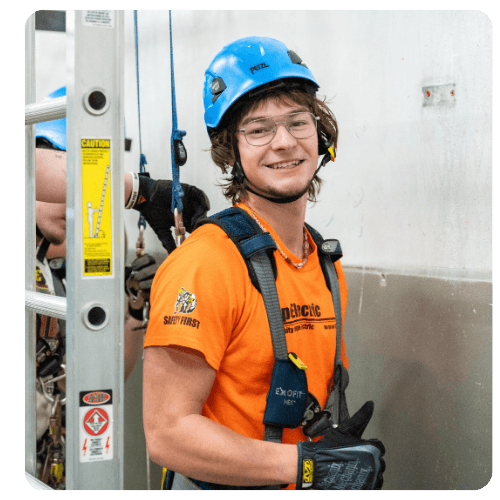 LRSC WIND student wearing safety helmet and harness during wind energy training.