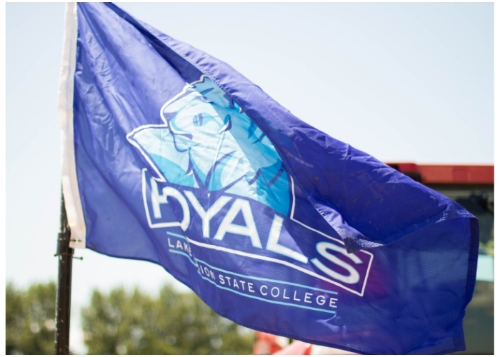 Royals Flag blowing in the wind outside. 