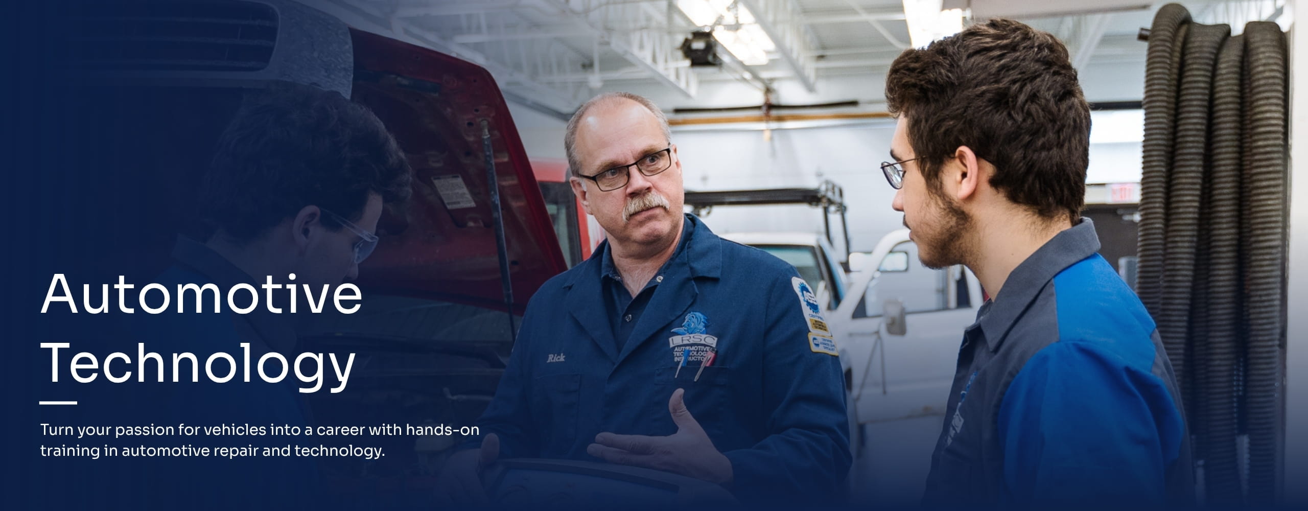 Students in the Automotive Technology program working with an instructor.