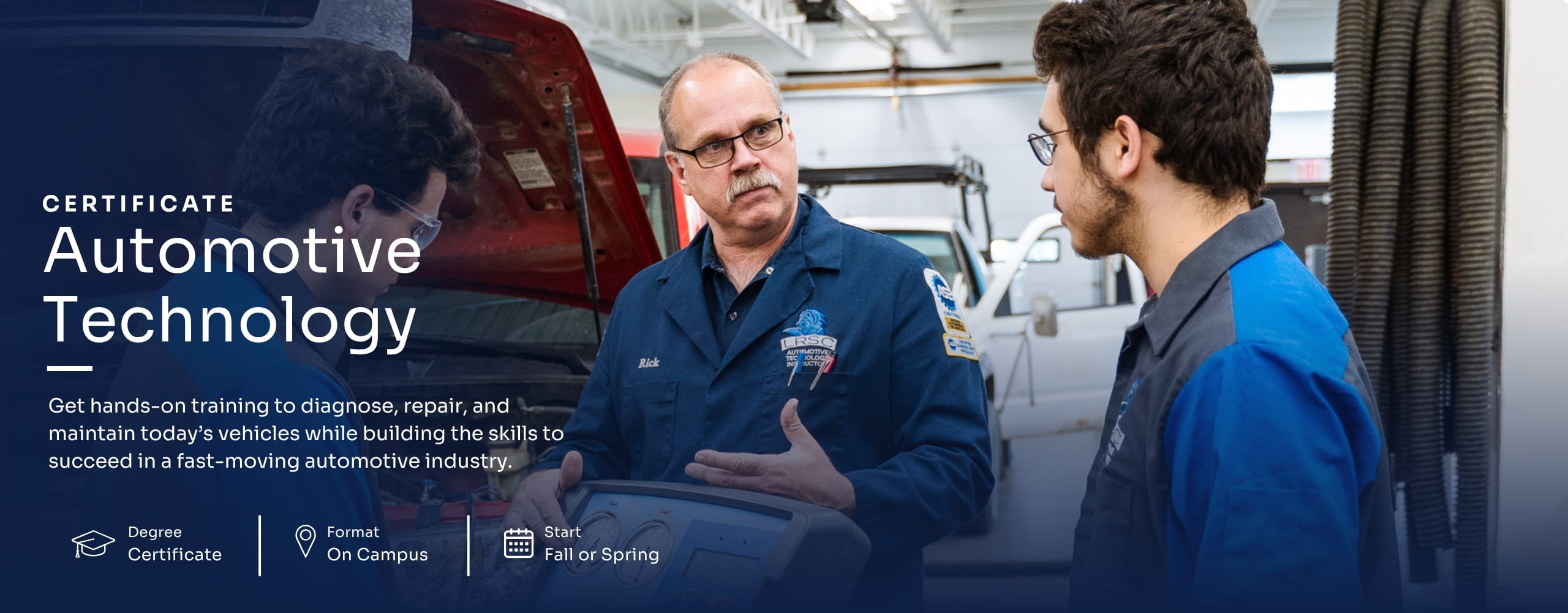 Automotive Technology instructor teaching two students in a shop.