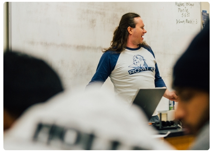 Instructor laughing while teaching.