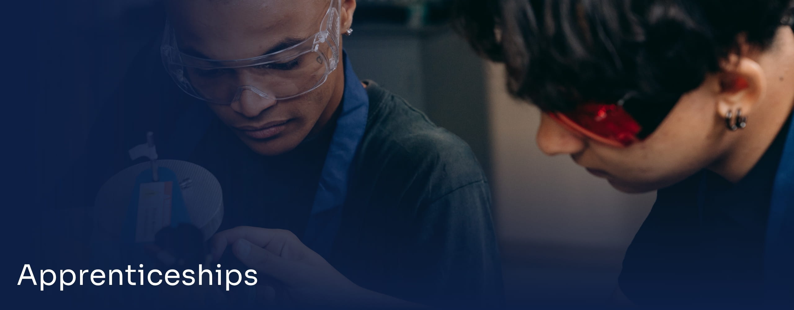 Apprenticeship banner with two students learning hands-on.