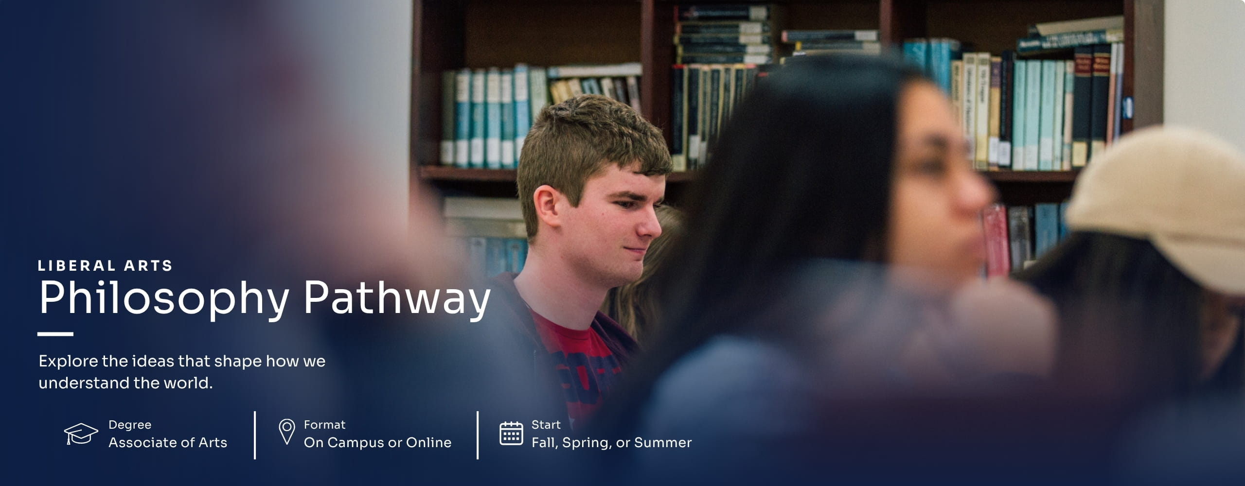 Student seated in a library classroom during a Philosophy Pathway course discussion.