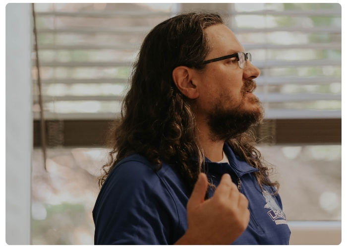Instructor teaching in front of a class.