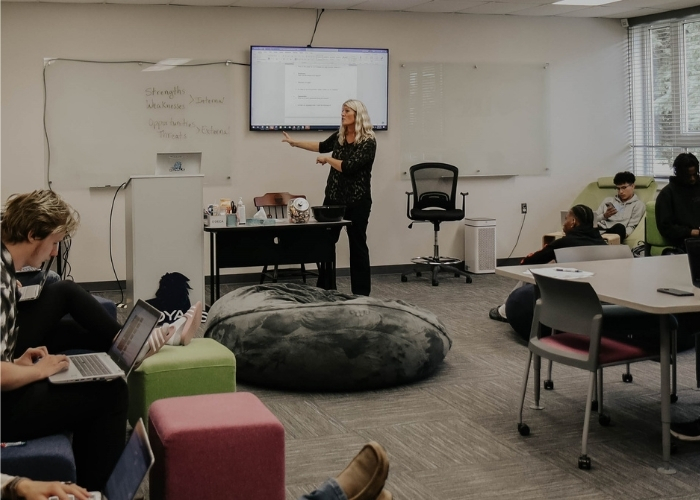 Instructor teaching in a classroom.