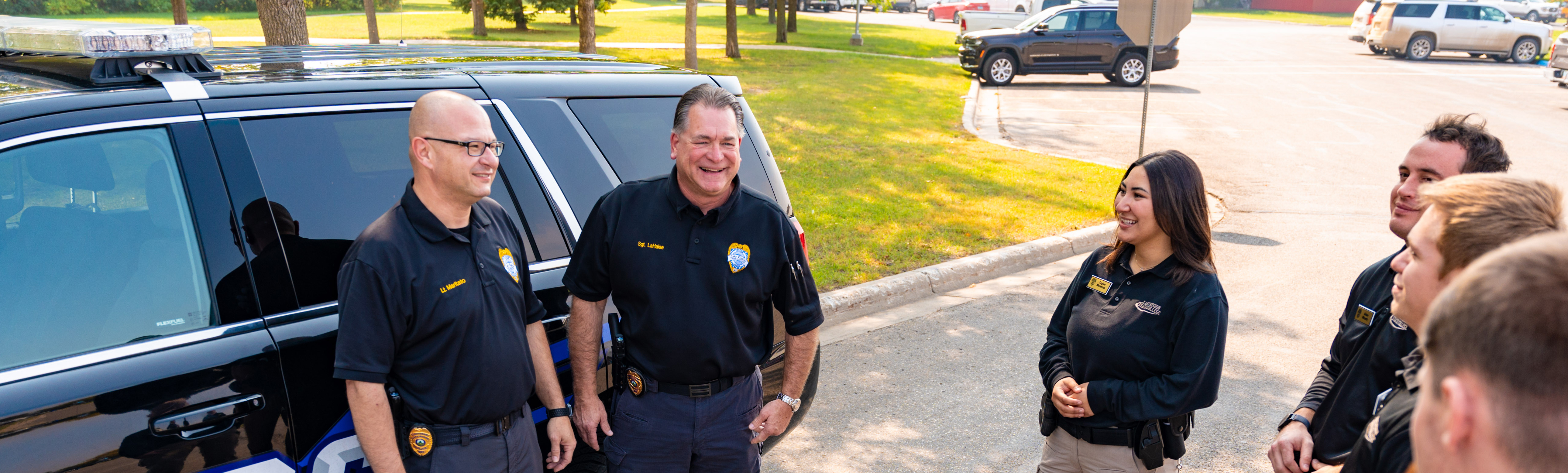 Peace officer instructors visiting with students