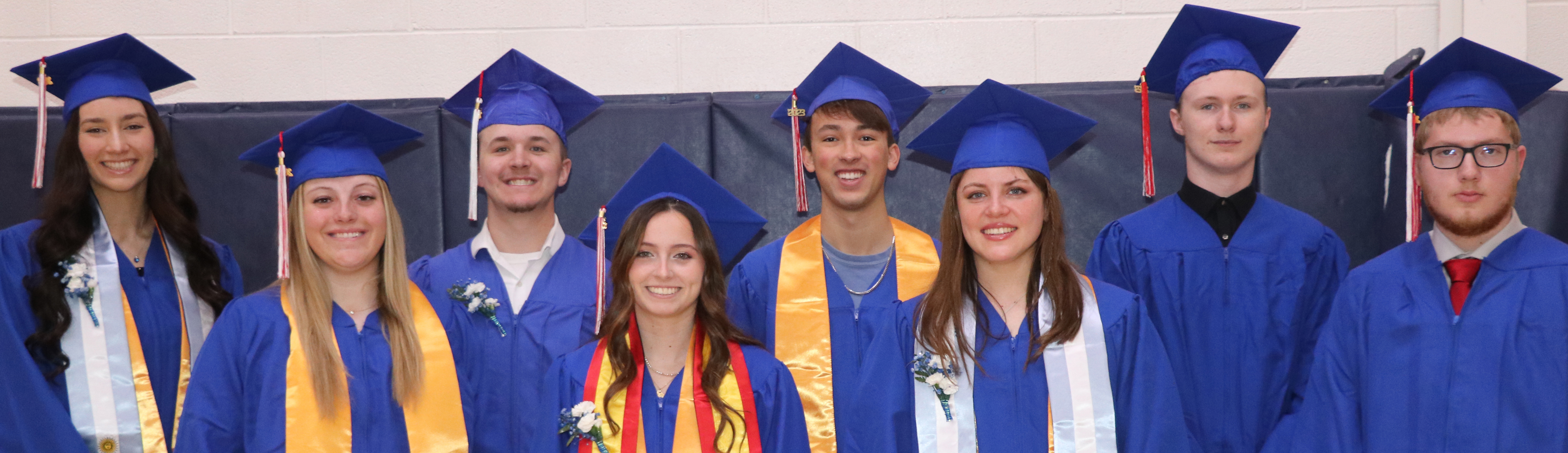 Student award winners in their graduation gowns. Iara Navarro, Tyson Tipton, Elijah PErson, Charles Craddock, Lainee Miller, Mencia Rodriguez Medio, Tiziana Huici and Dustyn Nelsen