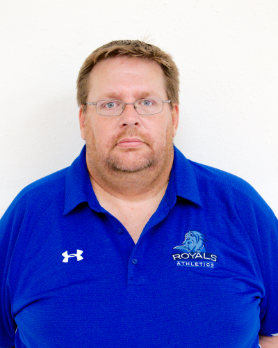 male posed for headshot in front of royals logo