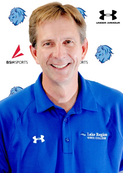 male posed for headshot in front of royals logo