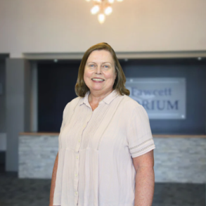 Picture of April Hubbard in front of the LRSC entrance. 