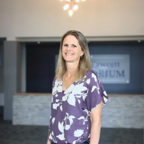 Picture of Tammy Riggin in front of the LRSC entrance. 