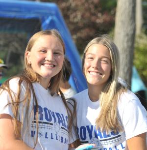 Two female co-eds pose at outdoor gathering at LRSC