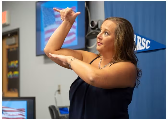 Lake Region State College instructor signing to students during an American Sign Language class.