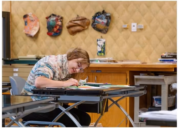 Art student working on a project in a studio.