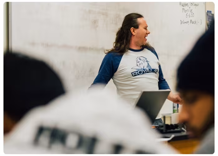 Instructor laughing while teaching.