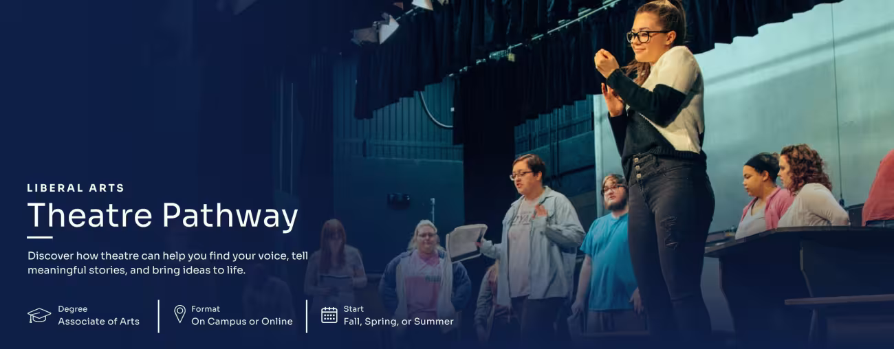 Students gather on stage during a theater rehearsal.