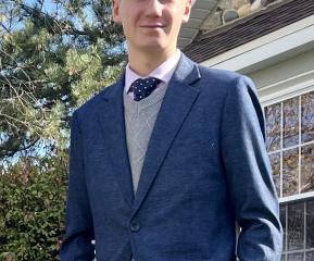 young blonde man with a tux on