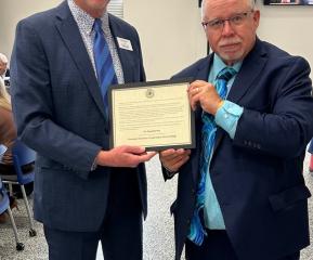 SBHE Chair Mihalick presents President Darling with his President Emeritus certificate