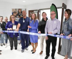 members of LRSC and Altru along with GF Chamber ambassadors prepare to cut the ribbon