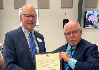 SBHE Chair Mihalick presents President Darling with his President Emeritus certificate