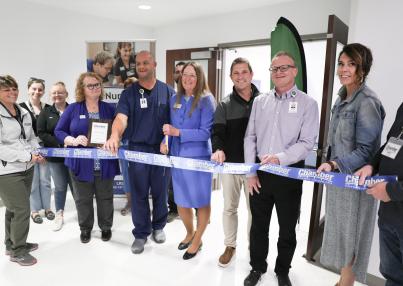 members of LRSC and Altru along with GF Chamber ambassadors prepare to cut the ribbon