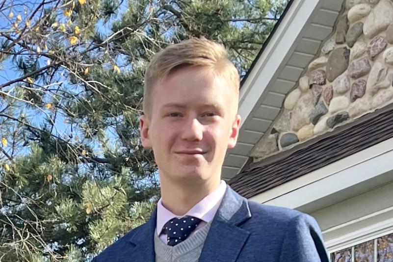 young blonde man with a tux on