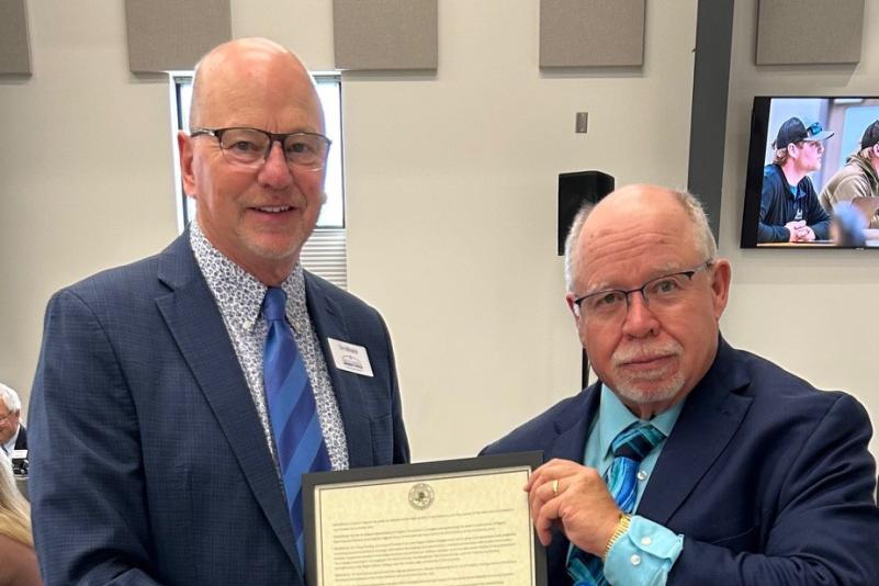 SBHE Chair Mihalick presents President Darling with his President Emeritus certificate