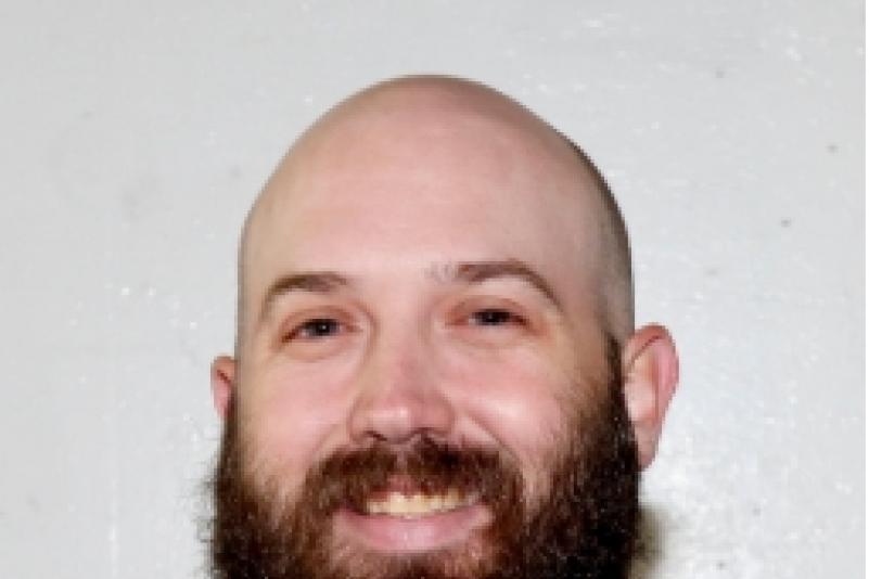 Headshot of Cole Klubek, new women's hockey coach at LRSC