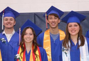 Student award winners in their graduation gowns. Iara Navarro, Tyson Tipton, Elijah PErson, Charles Craddock, Lainee Miller, Mencia Rodriguez Medio, Tiziana Huici and Dustyn Nelsen